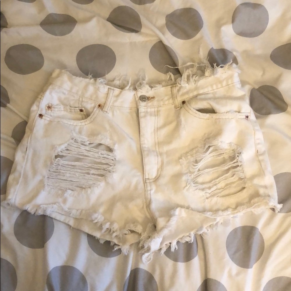 White ripped jean shorts.